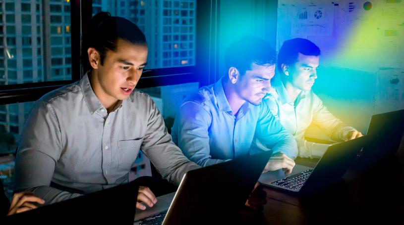three young men working in cyber security lab 